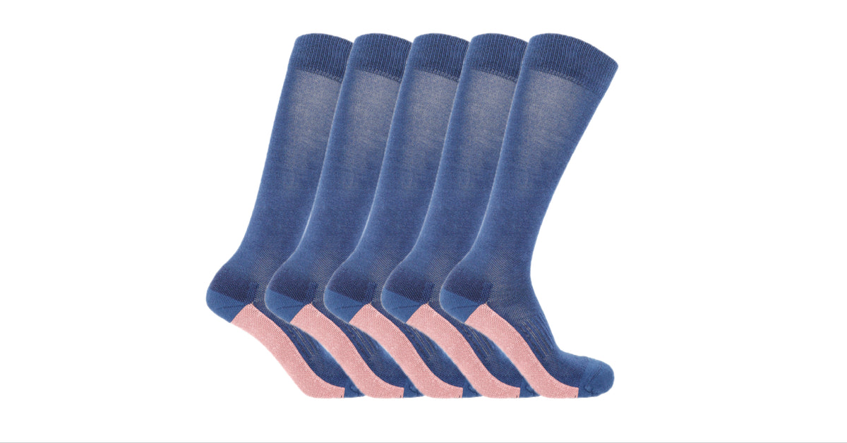 Five Soleberie Navy Classic Long Socks  in a staggered fan arrangement, featuring a navy body with a contrasting light pink sole, set against a plain white background.
