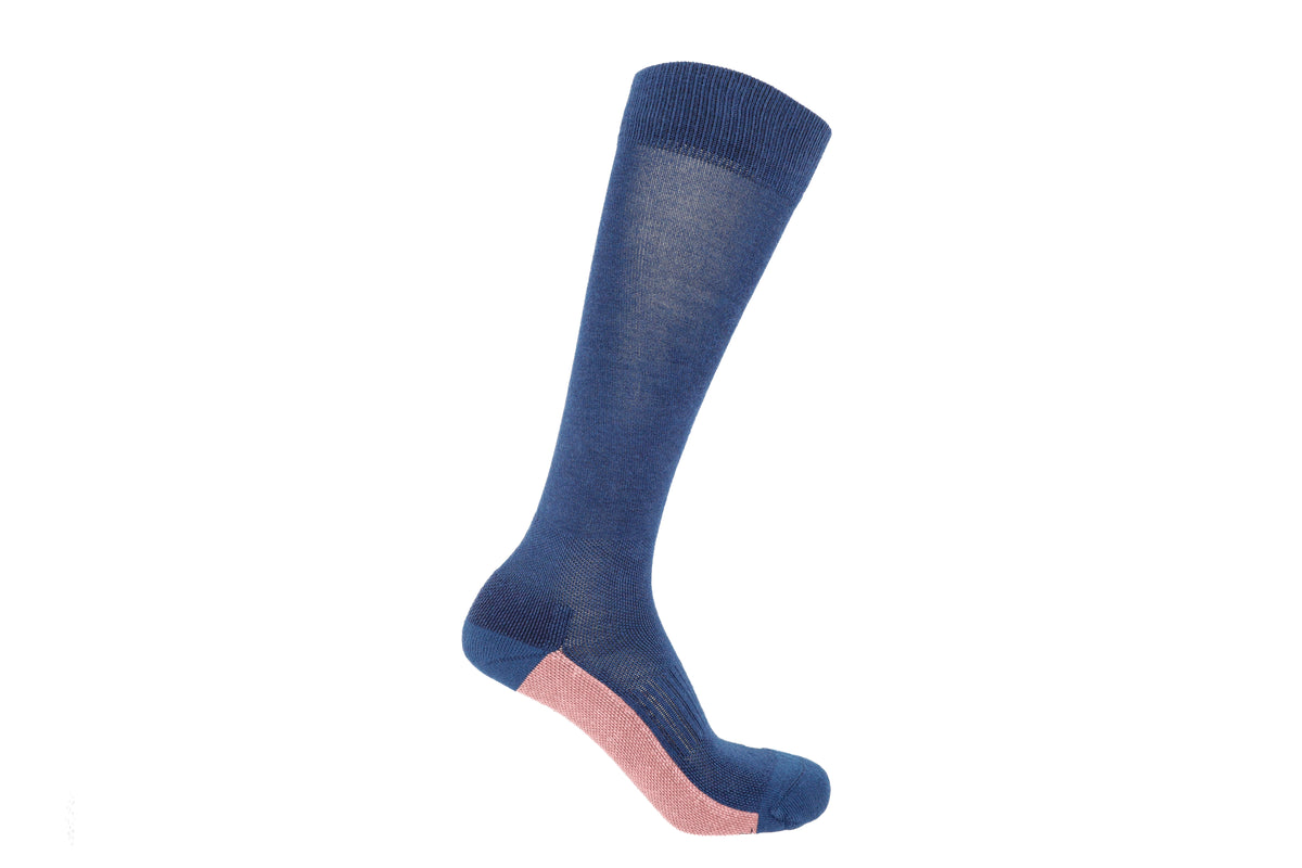 A single knee-high sock in navy blue with a contrasting light pink heel section, shown on a white background.