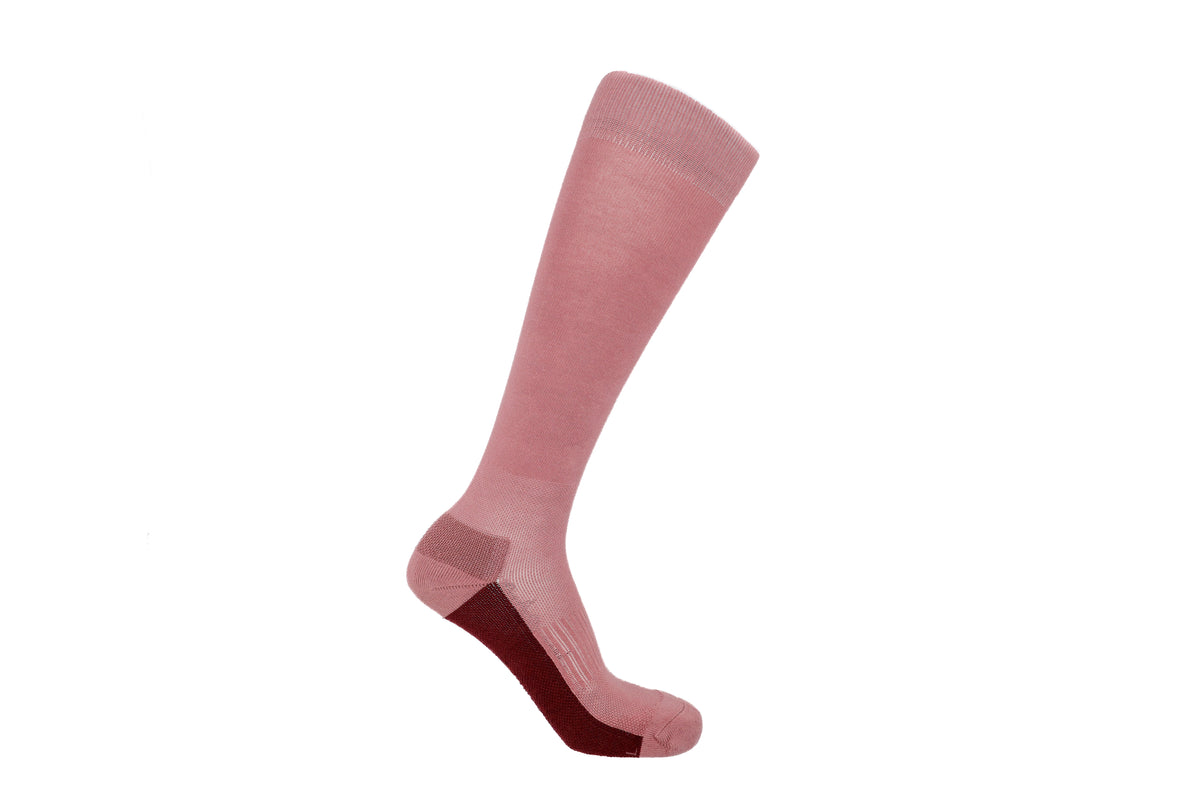 A single knee-high sock in pink with a burgundy heel, shown on a white background.